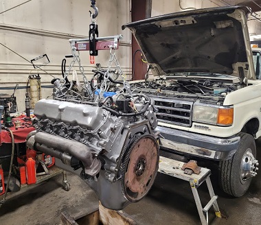 truck in the garage with engine out of it